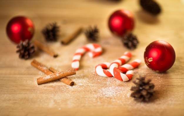 Christmas cookies with festive decoration with candy on wooden background and Christmas decorations