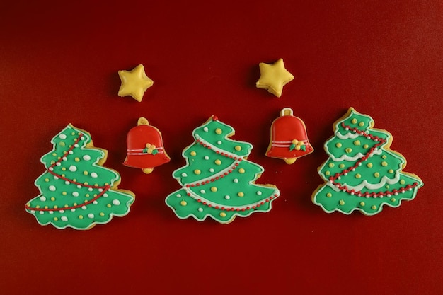 Christmas cookies with royal icing decoration with Red background