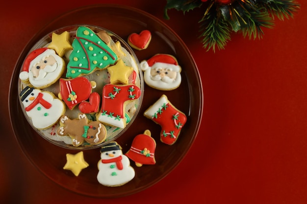 Christmas cookies with royal icing decoration with Red background