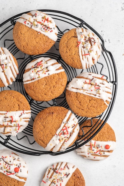 Christmas cookies with white frosting and holiday sprinkles