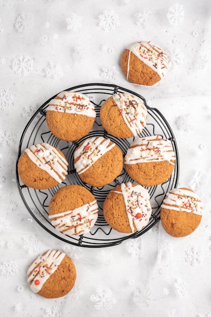 Christmas cookies with white frosting and holiday sprinkles