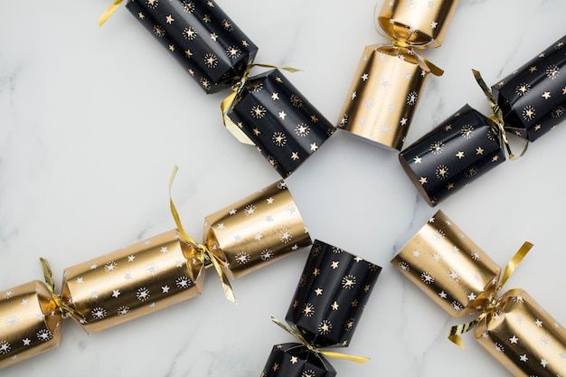 Christmas crackers luxury gold and black festive crackers on a marble background