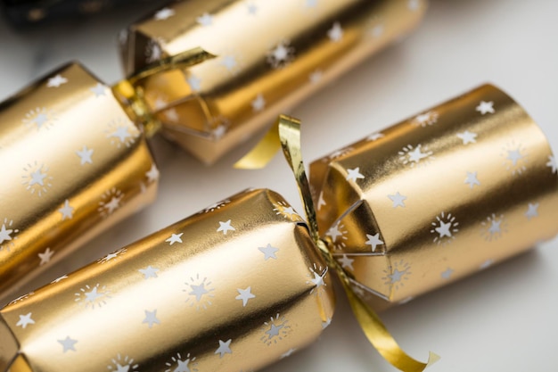 Christmas crackers luxury gold and black festive crackers on a\
marble background