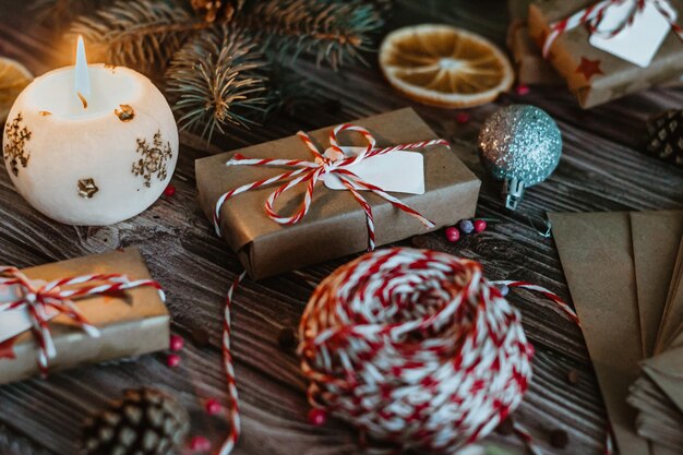 Christmas craft gift with red ribbon closeup on holiday eve vintage photo dark wooden background