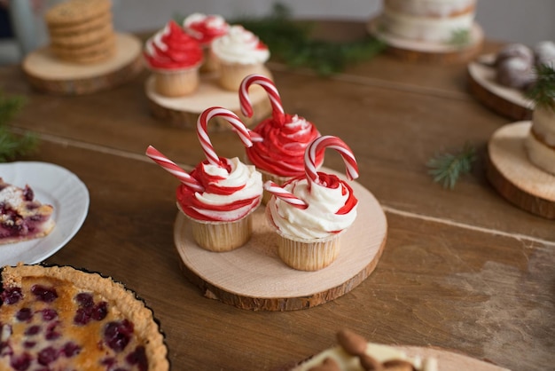 Christmas cupcake with caramel on a wooden stand