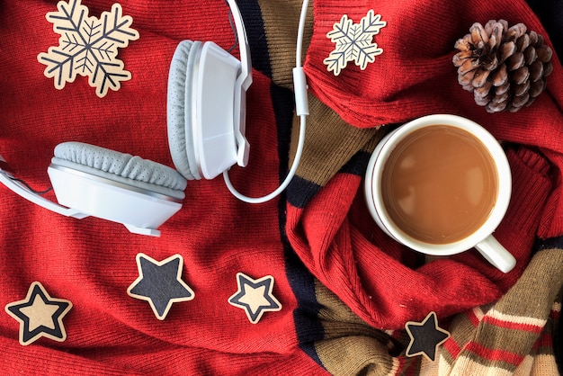 christmas day, coffee cup on red fabric 