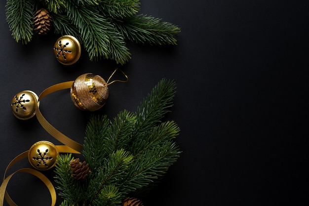 Christmas deco with fir and baubles on dark background. Flat Lay. Christmas concept