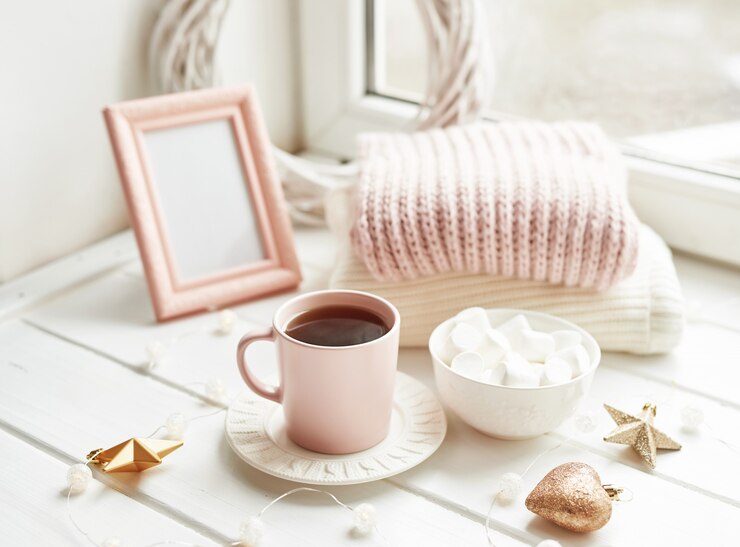 Christmas decor, balls, woolen plaid on the window , home comfort concept, seasonal winter celebrations. . Christmas pink cup with marshmallow.