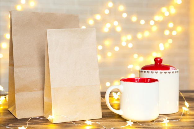 Christmas decor of food delivery service disposable kraft paper package. Ready-made order, eco-friendly recyclable packaging, zero waste. Holidays catering, making sweets home made. mock up, tag