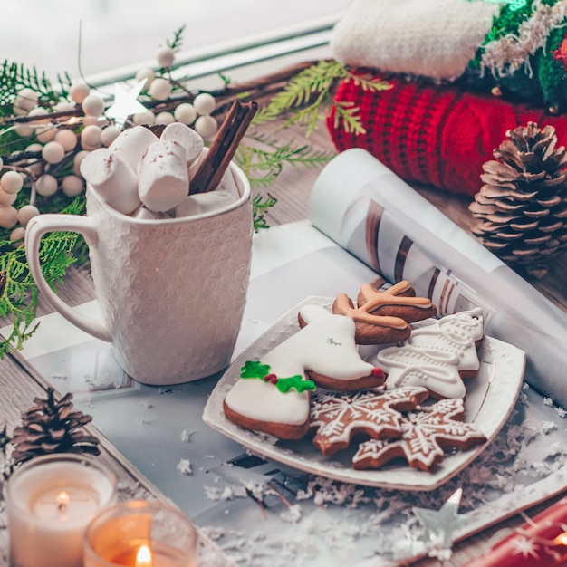 Christmas decor Warm sweater, cup of hot cocoa with marshmallow.