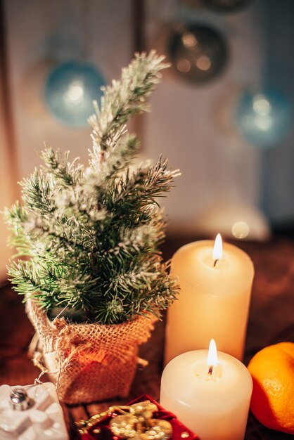 Christmas decor with candles and gifts