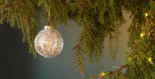 Christmas decor with golden balls on background dark wall