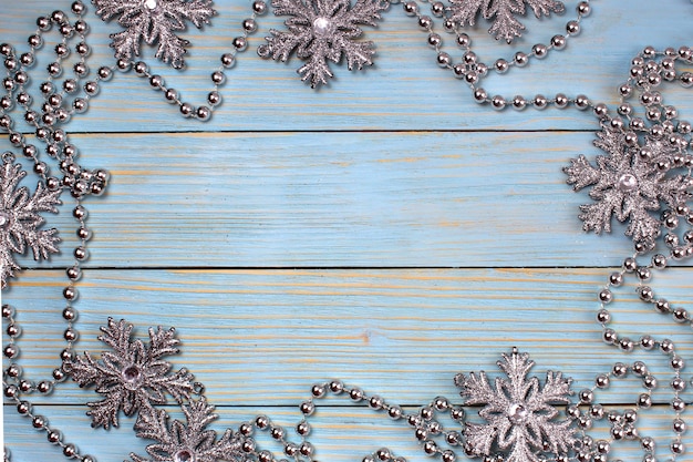Christmas decor with snowflakes and garlands on wooden
