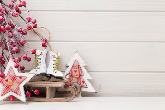 Christmas decor on the wooden white background