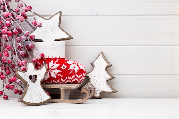 Christmas decor on the wooden white background