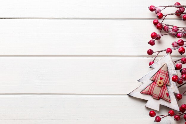 Christmas decor on the wooden white background