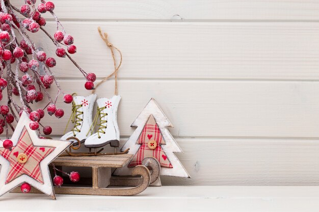 Christmas decor on the wooden white background