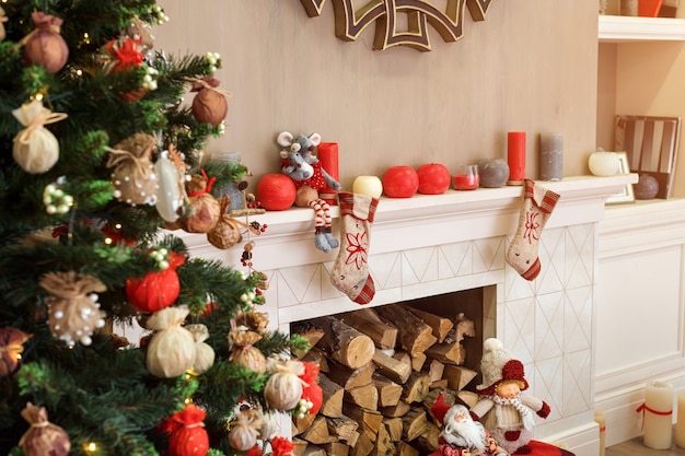 Christmas-decorated fireplace with firewood