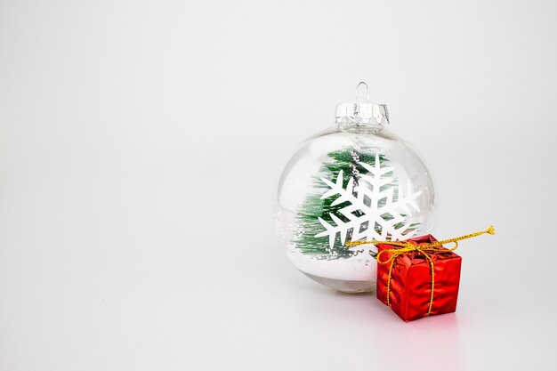 Christmas Decoration ball, red present on studio background