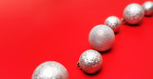 Christmas decoration balls on red bright background