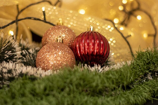 Christmas decoration balls with christmas lights and yellow background