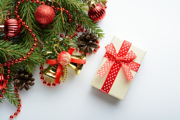 Christmas decoration bell, pine cones and branch