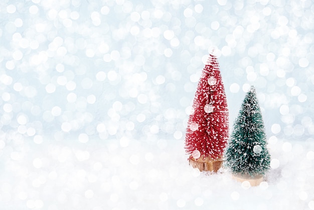 Christmas decoration. Christmas greeting card. Decorative Christmas fir tree, bokeh, snow.