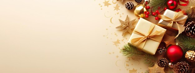 Christmas decoration composition on light gold background with beautiful golden gift box with red ribbon fir branches cones stars christmas cookiescinnamon top view copy space banner format