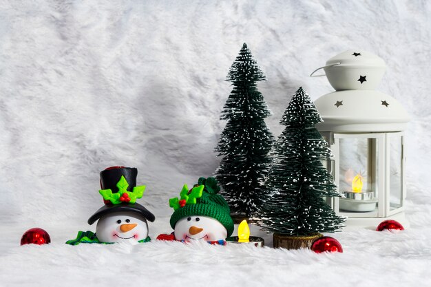 Christmas decoration of couple snowman and pine tree