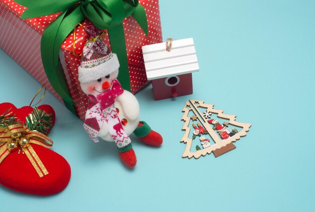 Christmas decoration cute object with wood or colour background Christmas color decorations fir tree branches on red background Flat lay top view copy space