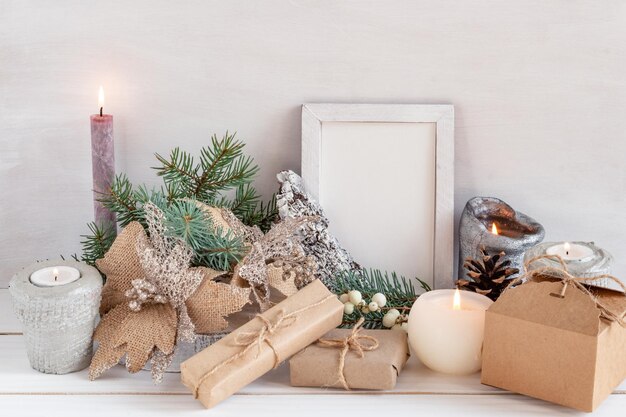 Photo christmas decoration frame mockup on a white table copy space