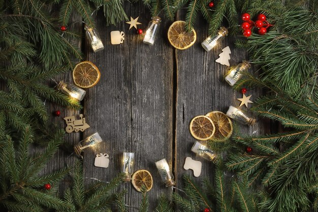 Christmas decoration frame on wooden background with different christmas toys