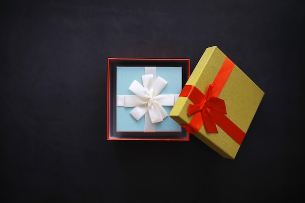 Christmas decoration. Gift boxes on black stone  background. Top view. Christmas greeting card concept.