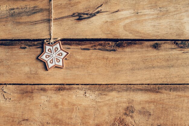 Christmas decoration hanging on wood background texture with copy space.