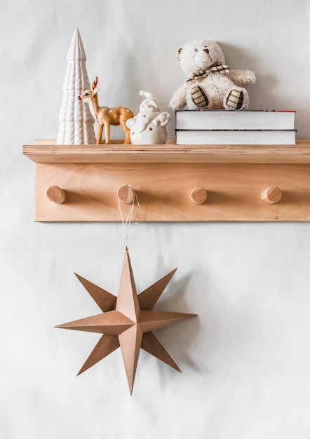 Christmas decoration interior Scandinavian Christmas star books Christmas decorations on a wooden shelfhanger in the children's room