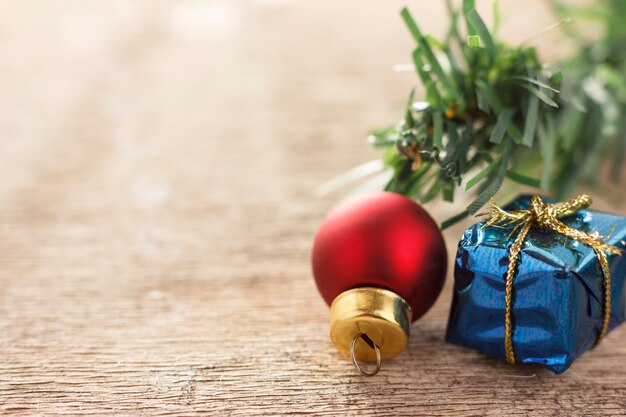 Christmas decoration. New year gifts and christmas tree balls on wooden background