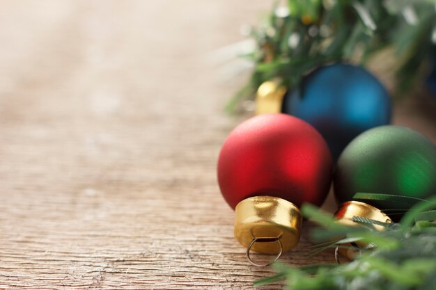 Christmas decoration. New year gifts and christmas tree balls on wooden background