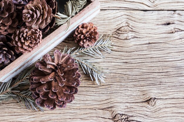 Christmas decoration of pine cones in wooden box