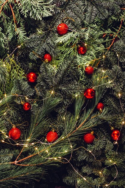 Christmas decoration, red balls, toys, fir branches, garland