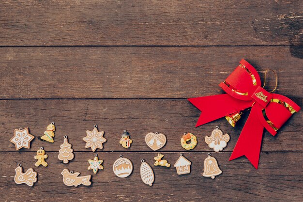 christmas decoration and red bow on wood background with copyspace.