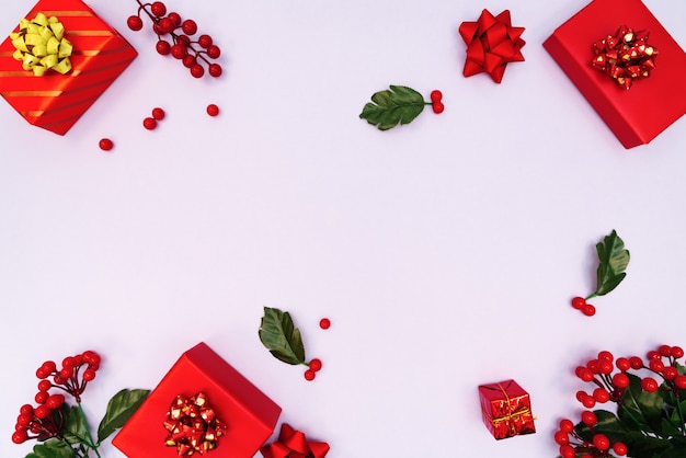 Christmas decoration. red gift box on purple background. Christmas, winter, new year concept. Flat lay, top view, copy space