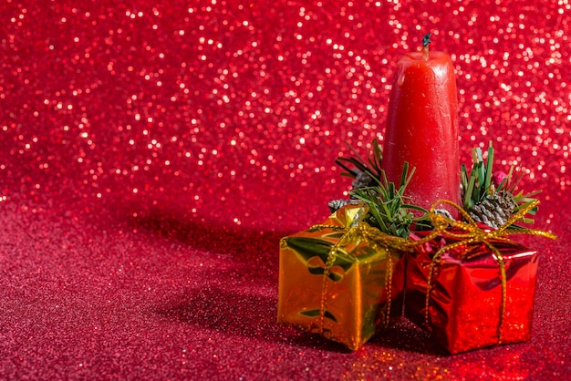 Christmas decoration on red sparkling background. Macro photo