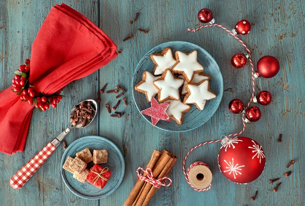 Christmas decoration in red and white on rustic turquoise wood