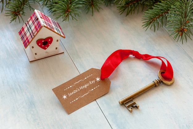 Christmas decoration - Santa's Magic Key. Close-up on light blue wooden background