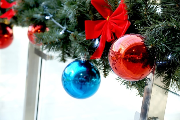 Christmas decoration of shopping center spheres, bows and branches of a fir-tree