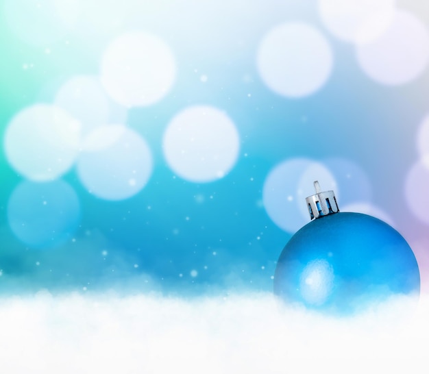 Christmas decoration in the snow on a colored background