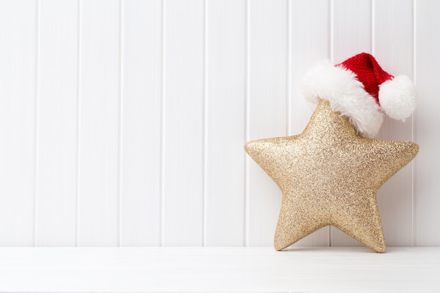 Christmas decoration on a white wooden surface.