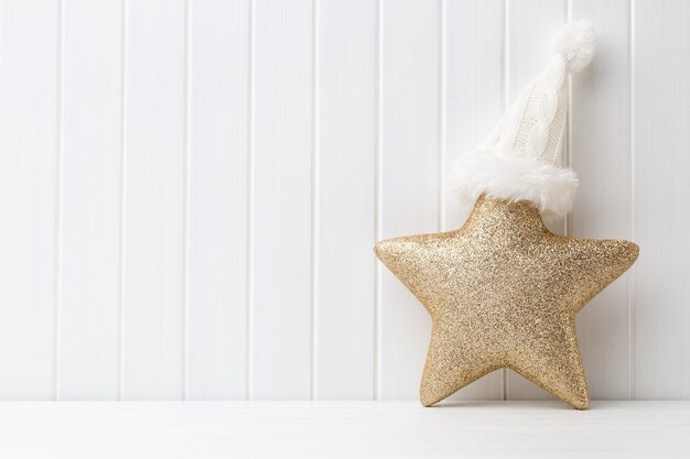 Christmas decoration on a white wooden surface.