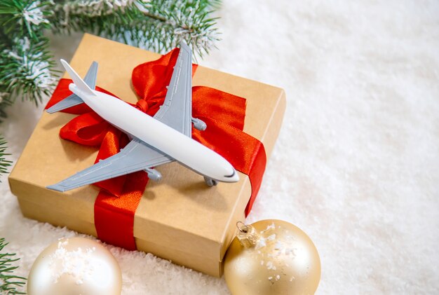 Christmas decoration with airplane, travel concept for the holidays