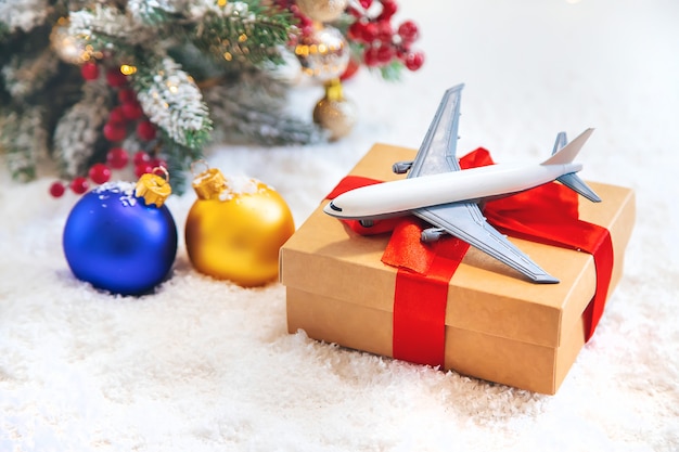 christmas decoration with airplane, travel concept for the holidays